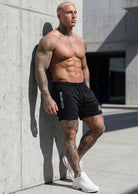 JCKD 1023 Relentless Flex Shorts black, bold Relentless graphic on flex cut performance gym shorts